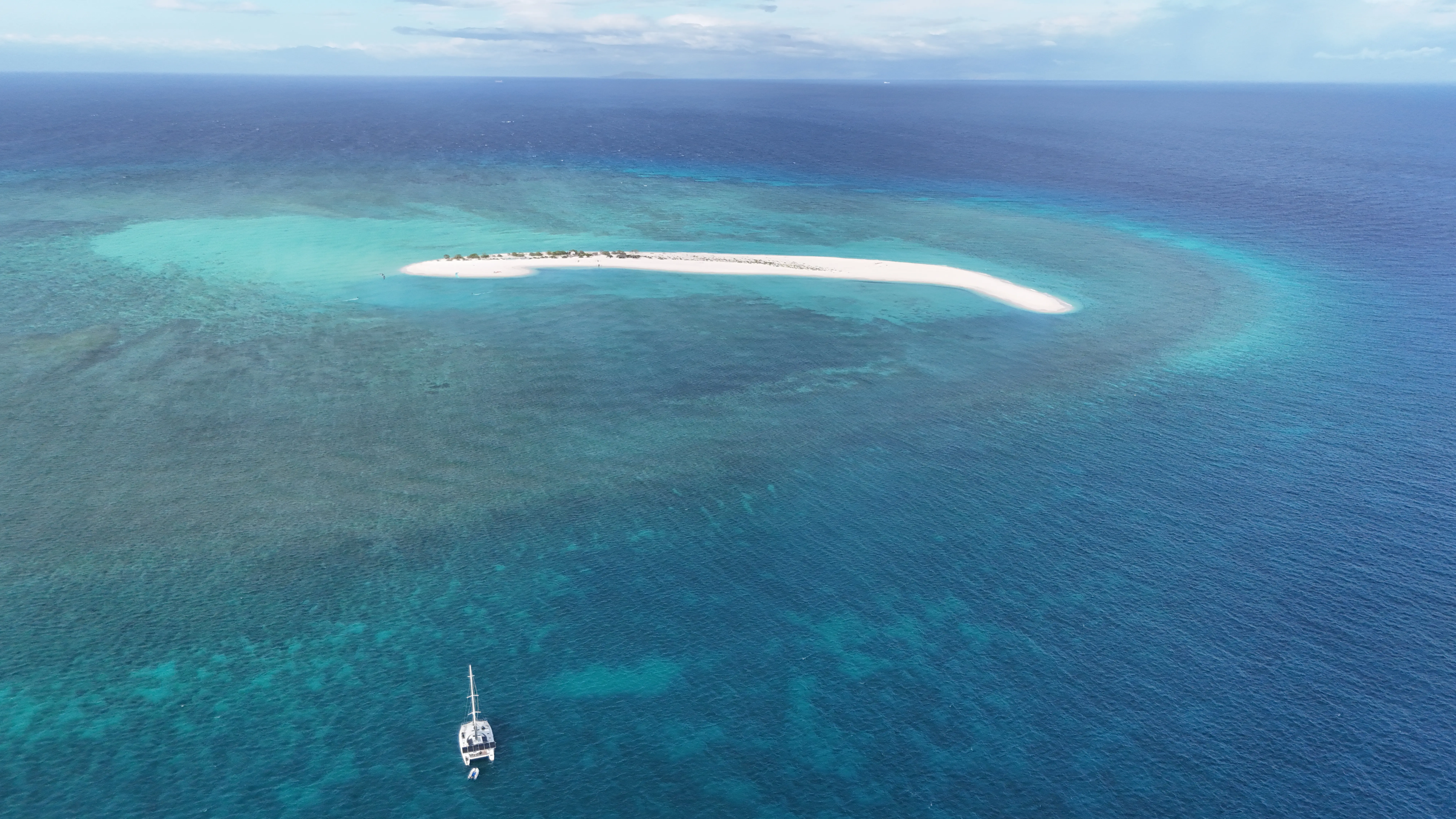 Aerial view of a remote sandbar and reef near Seco Island, Philippines
